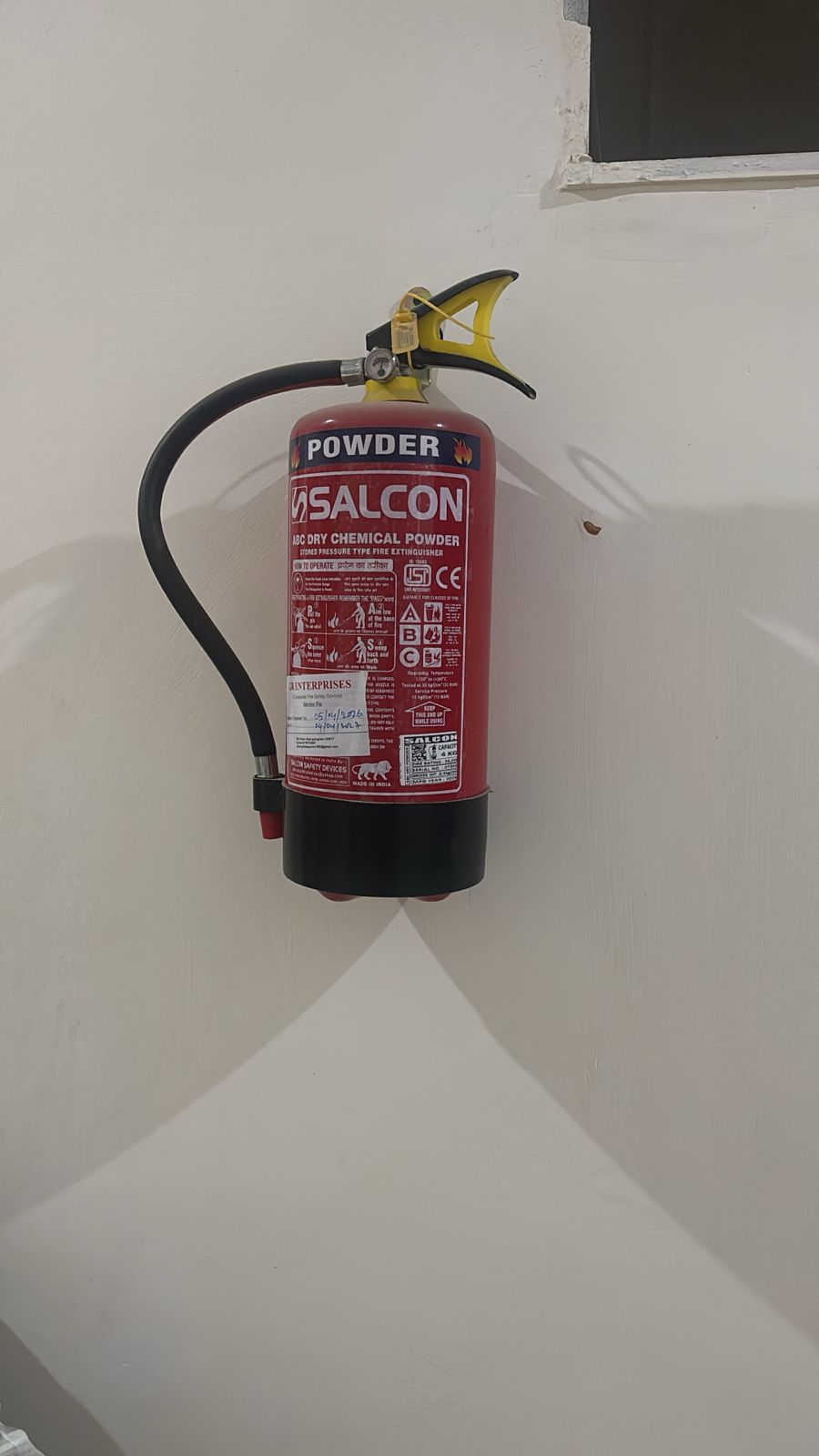 Fire extinguisher installed for fire safety at Yadav PG Gurugram